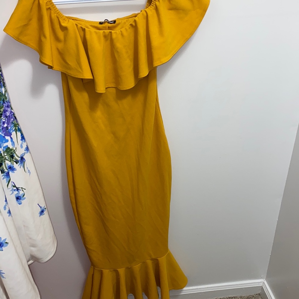 A yellow off the shoulder dress